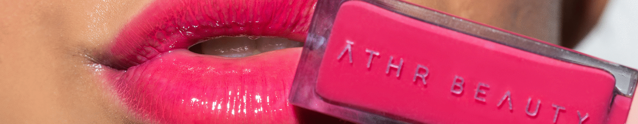 Closeup image of model wearing ATHR Beauty's lip product.