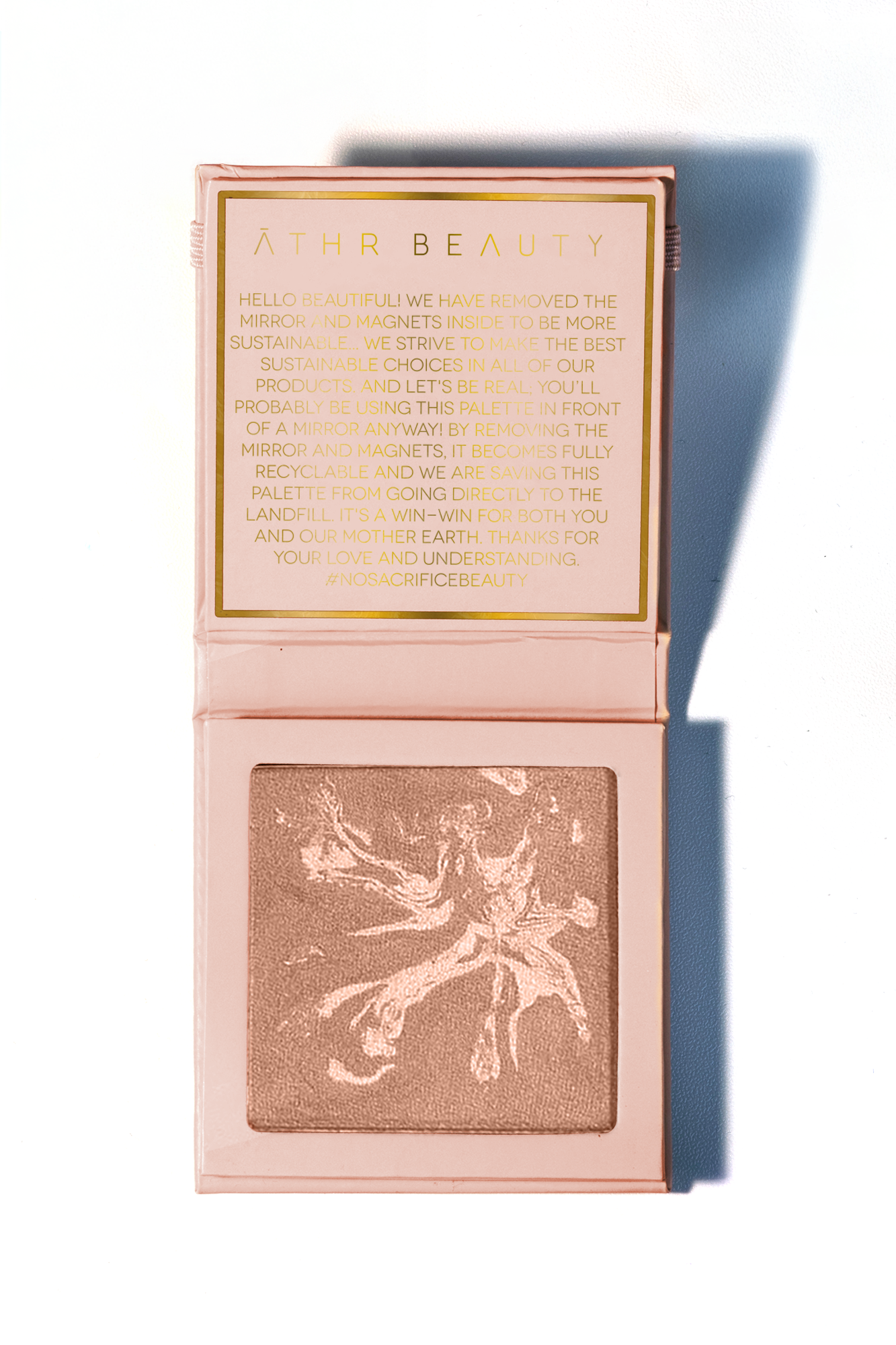 Studio product image of the 1-Pan "Aurora" Diffused Reflections Bronzing Powder, sitting open to show the shade color.