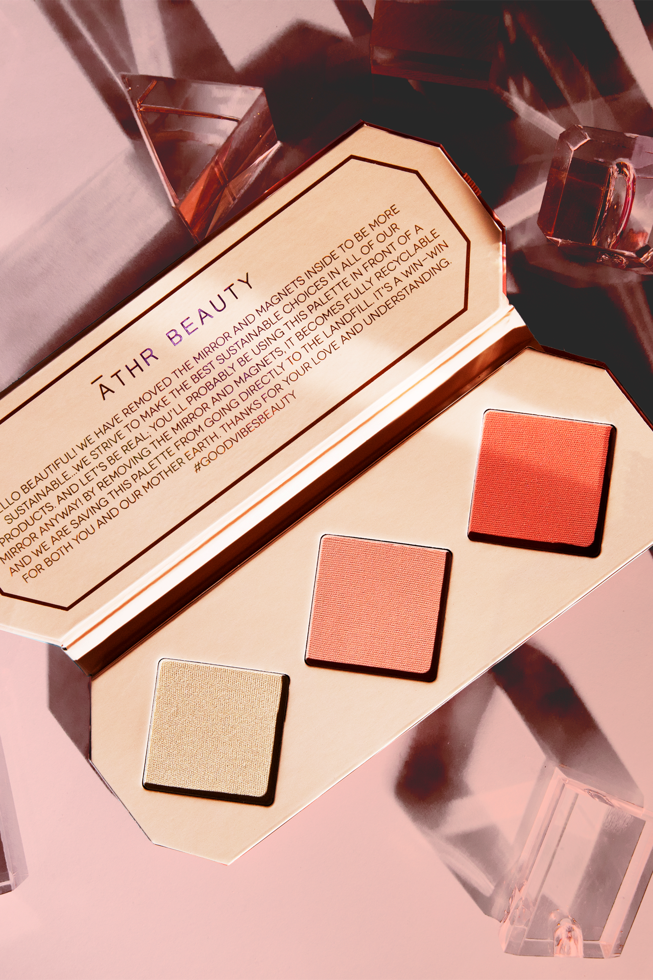Editorial product image of the 3-Pan "Amber" Crystal Charged Cheek Palette, sitting open to show the shade color.