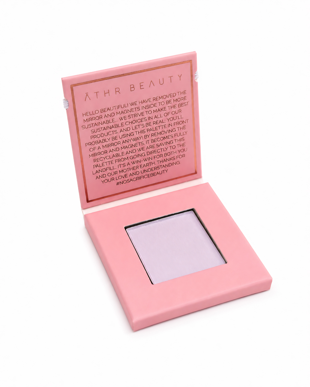 Pink makeup compact with lavender powder on a white background