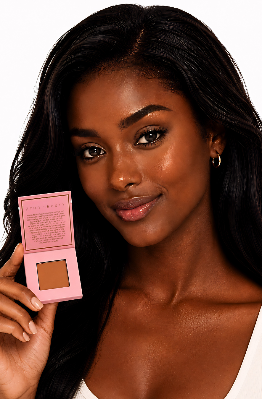 Woman holding a pink compact with a brown powder