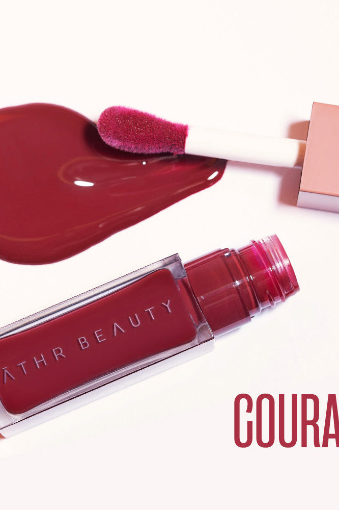 Flat lay product image of the Desert Rose Lip + Cheek Oil Stain in the deep red shade "Courage".