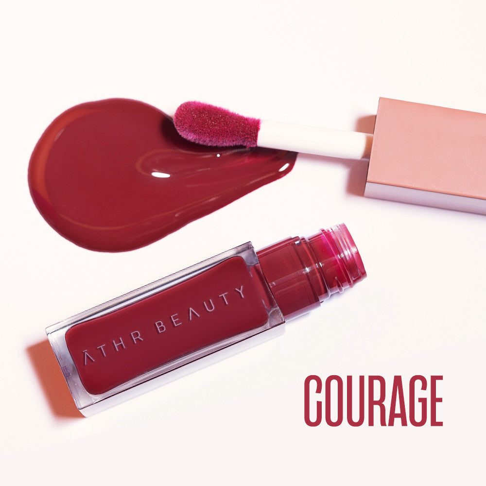 Flat lay product image of the Desert Rose Lip + Cheek Oil Stain in the deep red shade "Courage".