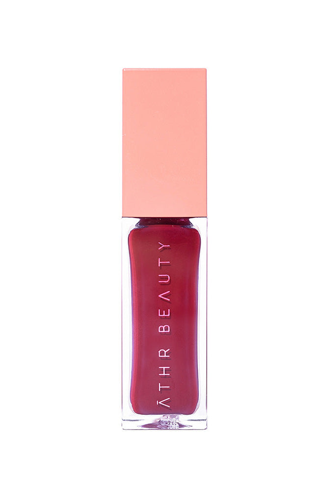 Studio product image of the Desert Rose Lip + Cheek Oil Stain in the deep red shade "Courage".