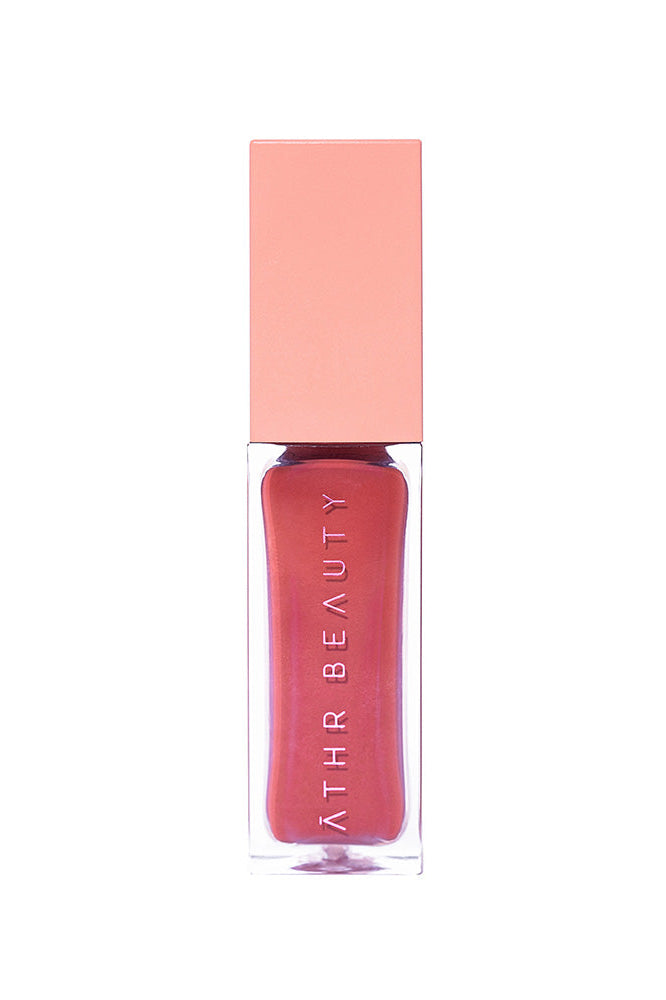 Studio product image of the Desert Rose Lip + Cheek Oil Stain in the light peach-tone shade "Harmony".