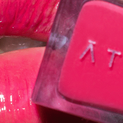 Closeup image of model wearing ATHR Beauty's lip product.