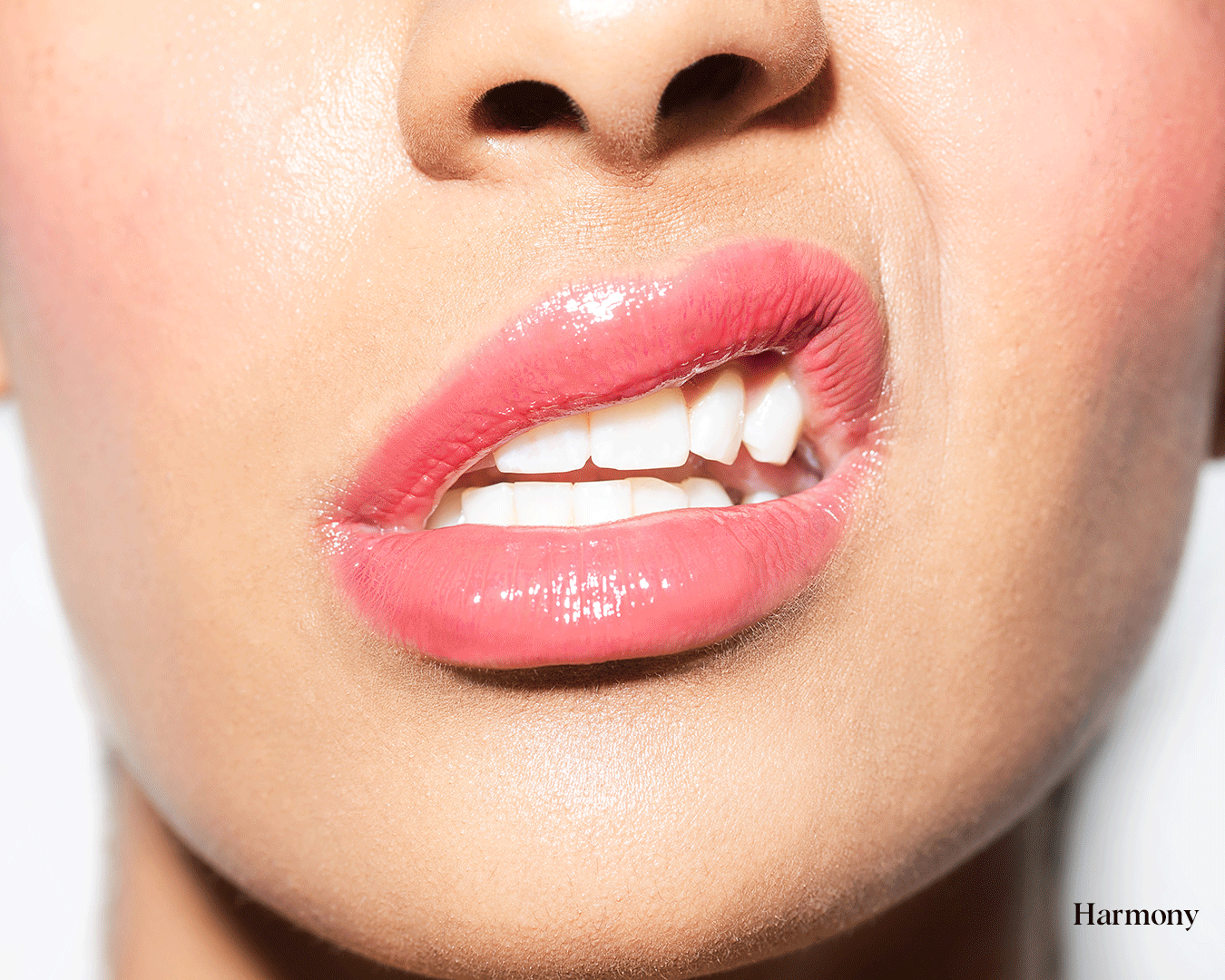 Closeup image of model wearing ATHR Beauty's lip product.