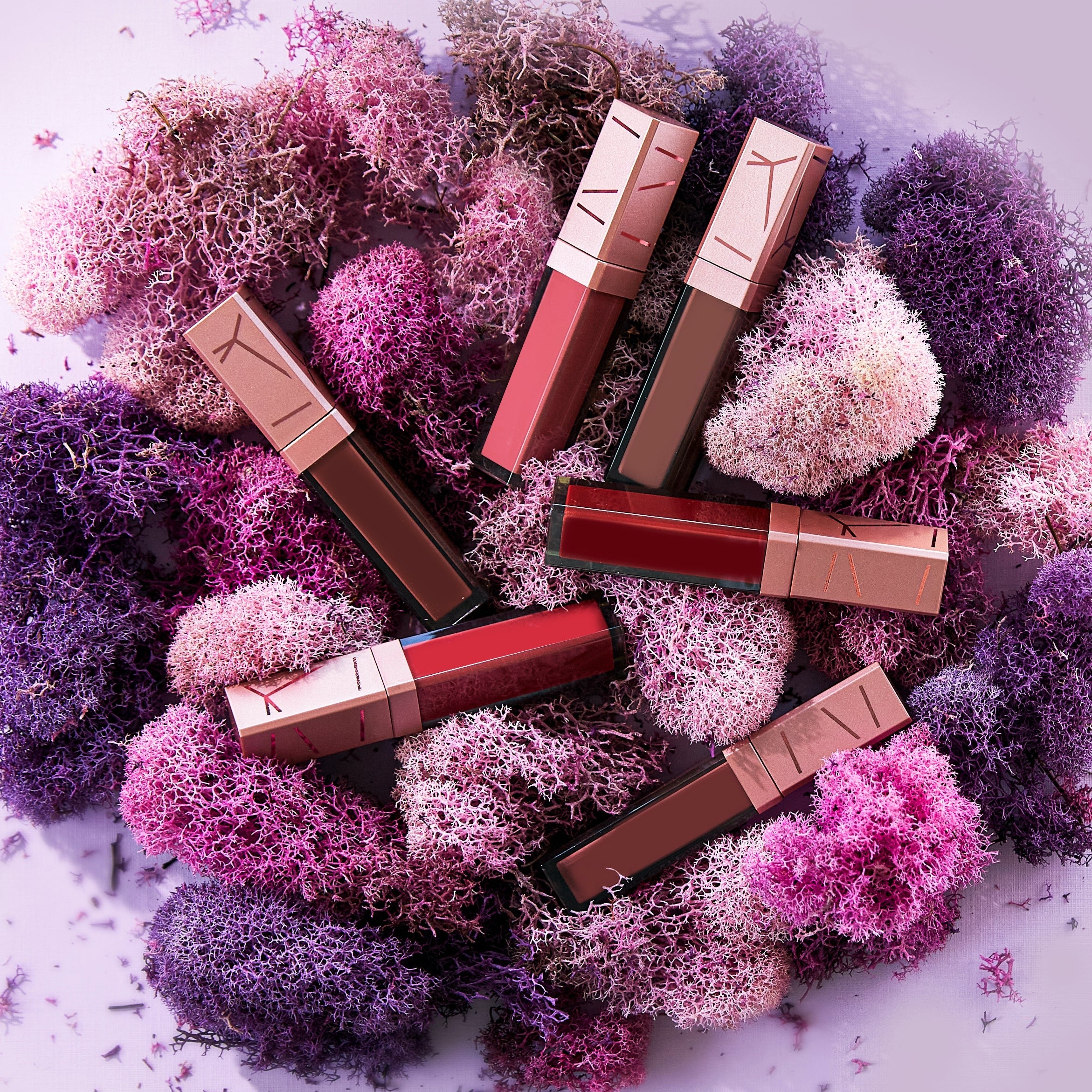 Editorial product image of the different Radiant Ruby Lip Creme shade options.
