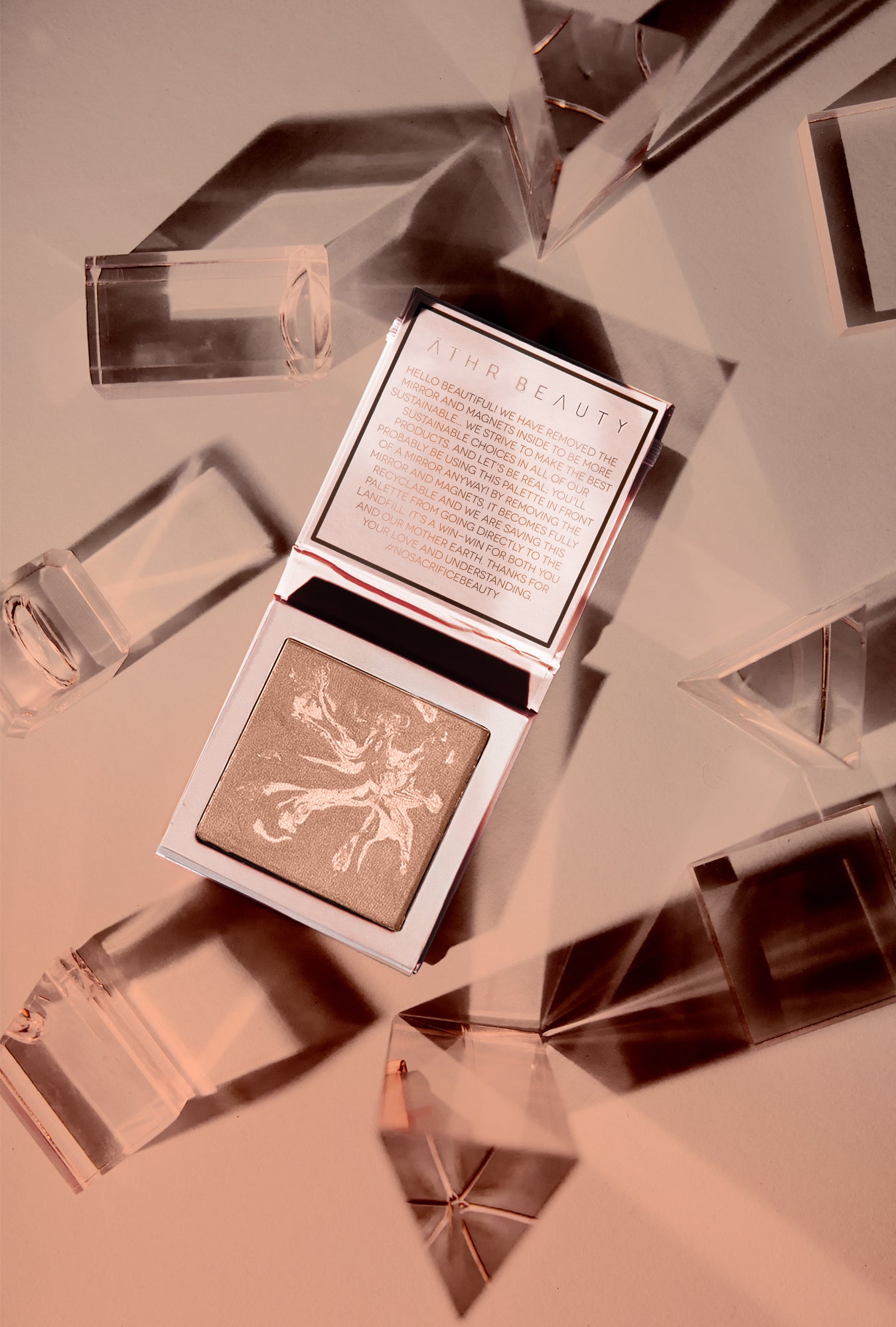 Editorial product image of the 1-Pan "Aurora" Diffused Reflections Bronzing Powder, sitting open to show the shade color.