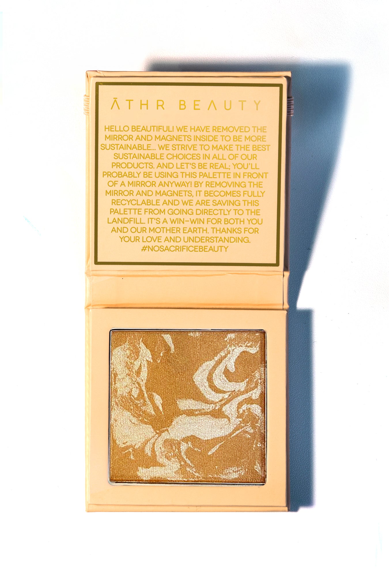Studio product image of the 1-Pan "Aurora" Diffused Reflections Bronzing Powder, sitting open to show the shade color.