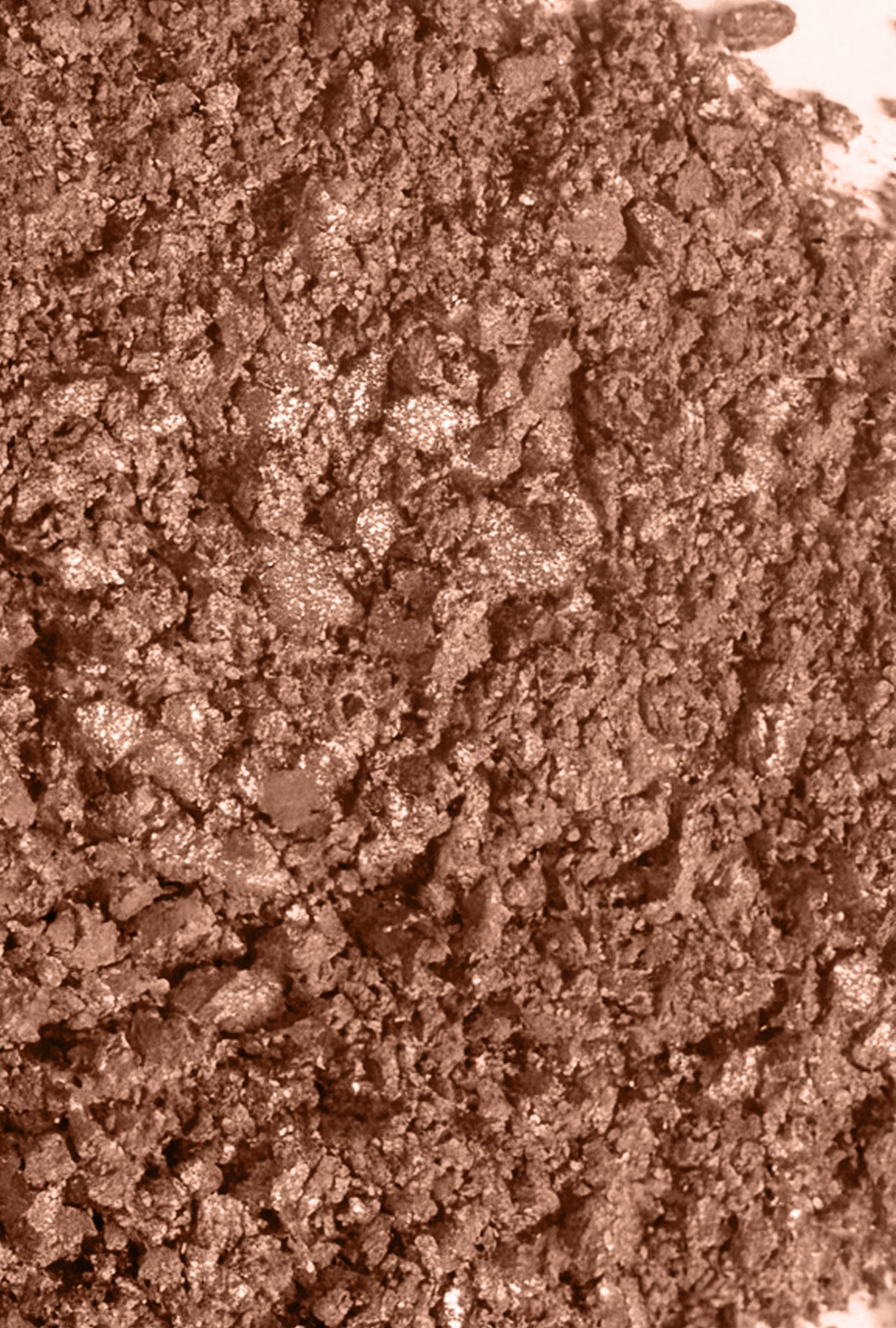 Swatch image of the 1-Pan "Aurora" Diffused Reflections Bronzing Powder, crushed to show the shade color.