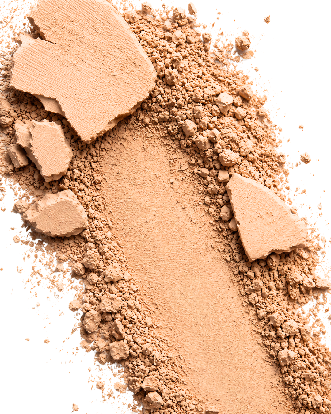 Close-up of the Desert Mirage Blurring Powder in the shade 'Citrine Sand' (a soft, warm beige with a banana-yellow tint) with a chunky texture on a white background