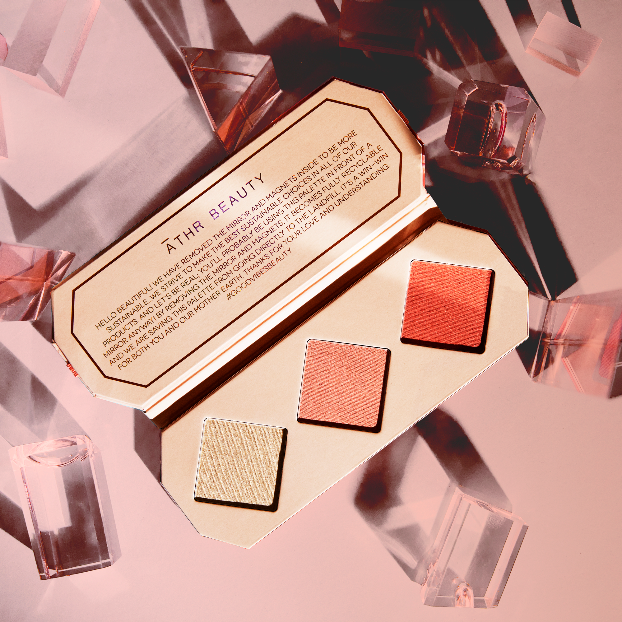 Editorial product image of the 3-Pan "Amber" Crystal Charged Cheek Palette, sitting open to show the shade color.