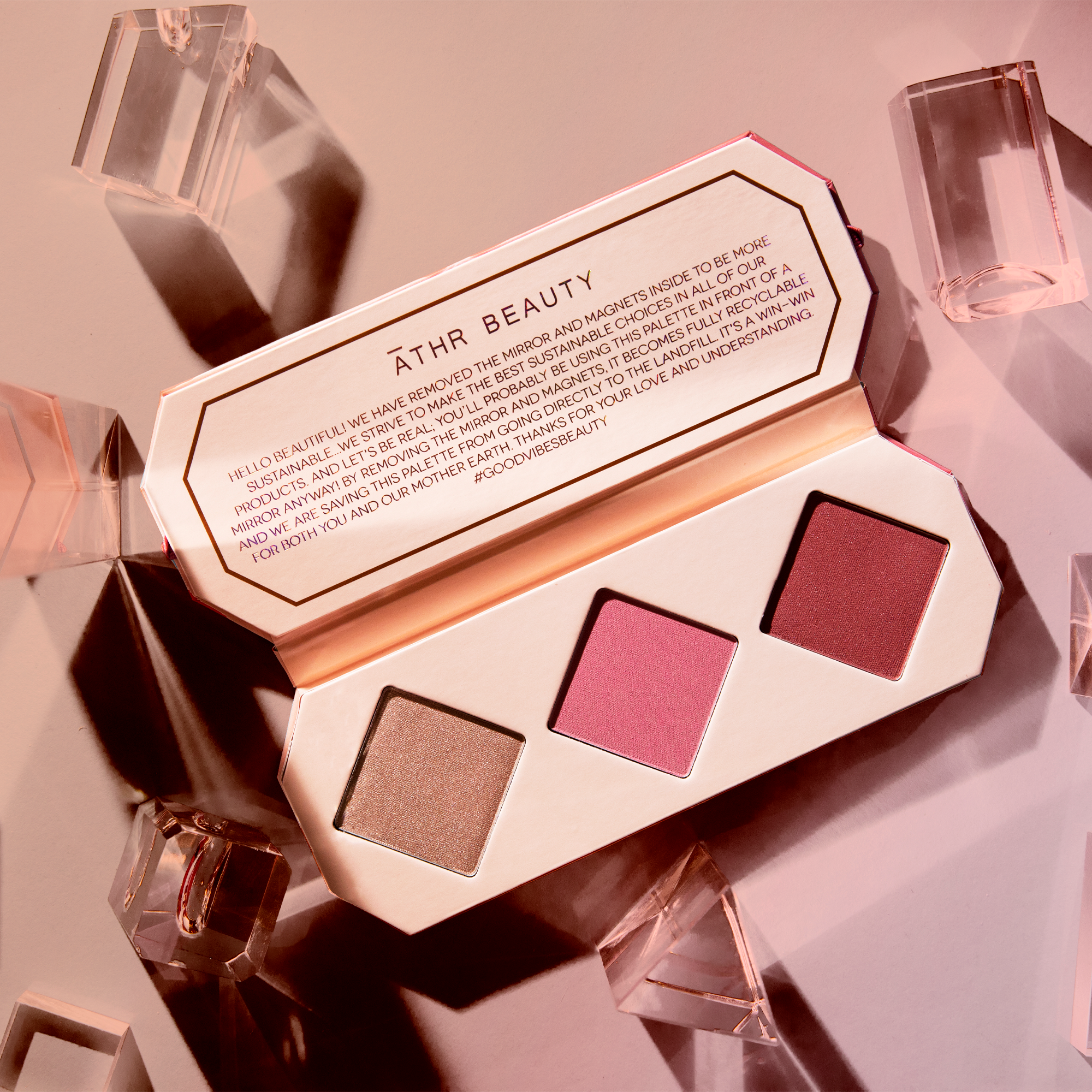 Editorial product image of the 3-Pan "Ruby" Crystal Charged Cheek Palette, sitting open to show the shade color.