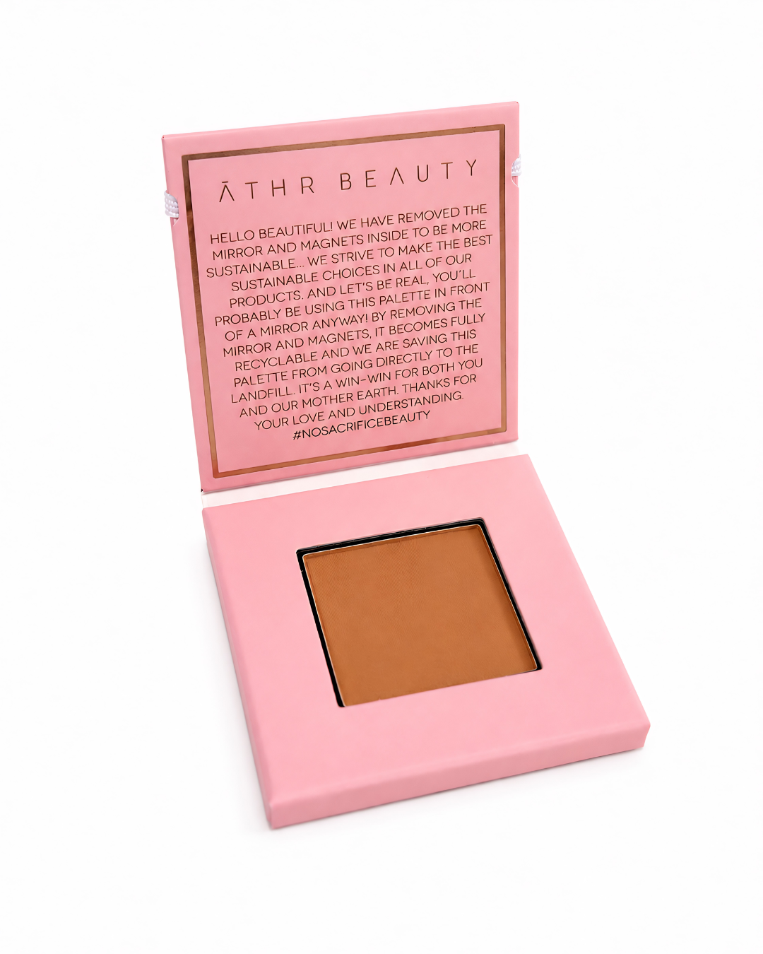 Pink makeup palette of Athr Beauty's 'Desert Mirage Blurring Powder' in the shade 'Sienna Duna' (a soft, rich honey-terracotta) on a white background