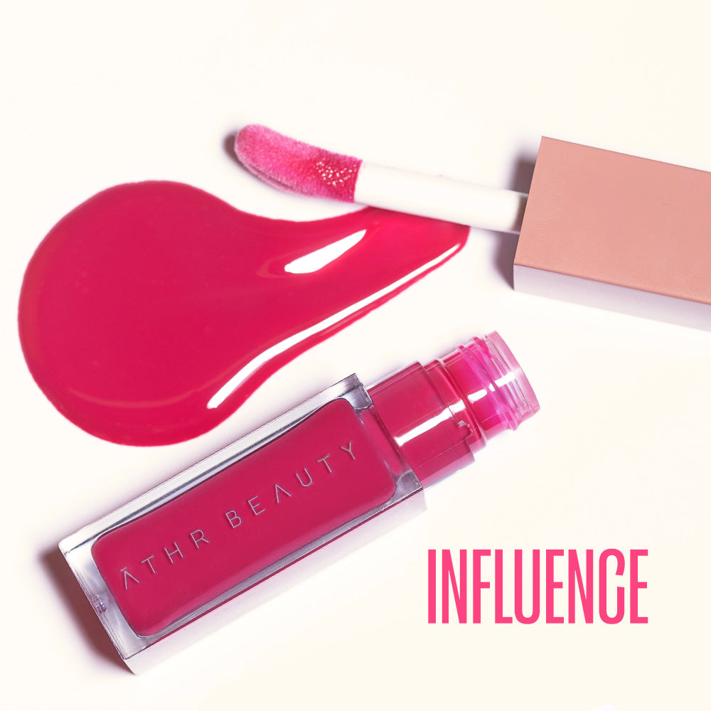 Flat lay product image of the Desert Rose Lip + Cheek Oil Stain in the hot pink shade "Influence".