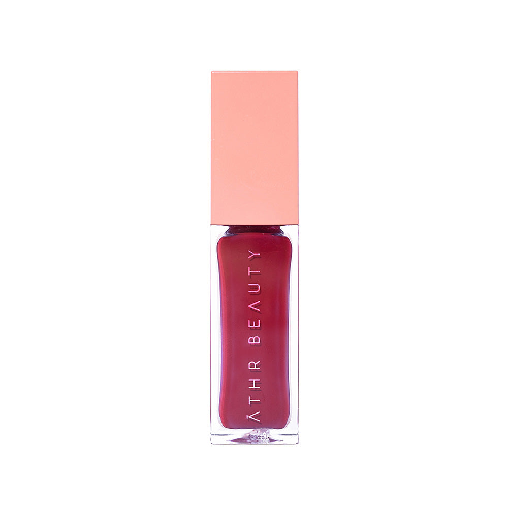 Studio product image of the Desert Rose Lip + Cheek Oil Stain in the deep red shade "Courage".